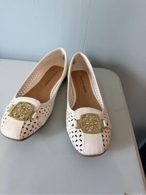 Christian Siriano Ivory Laser-Cut Flats with Gold Medallion